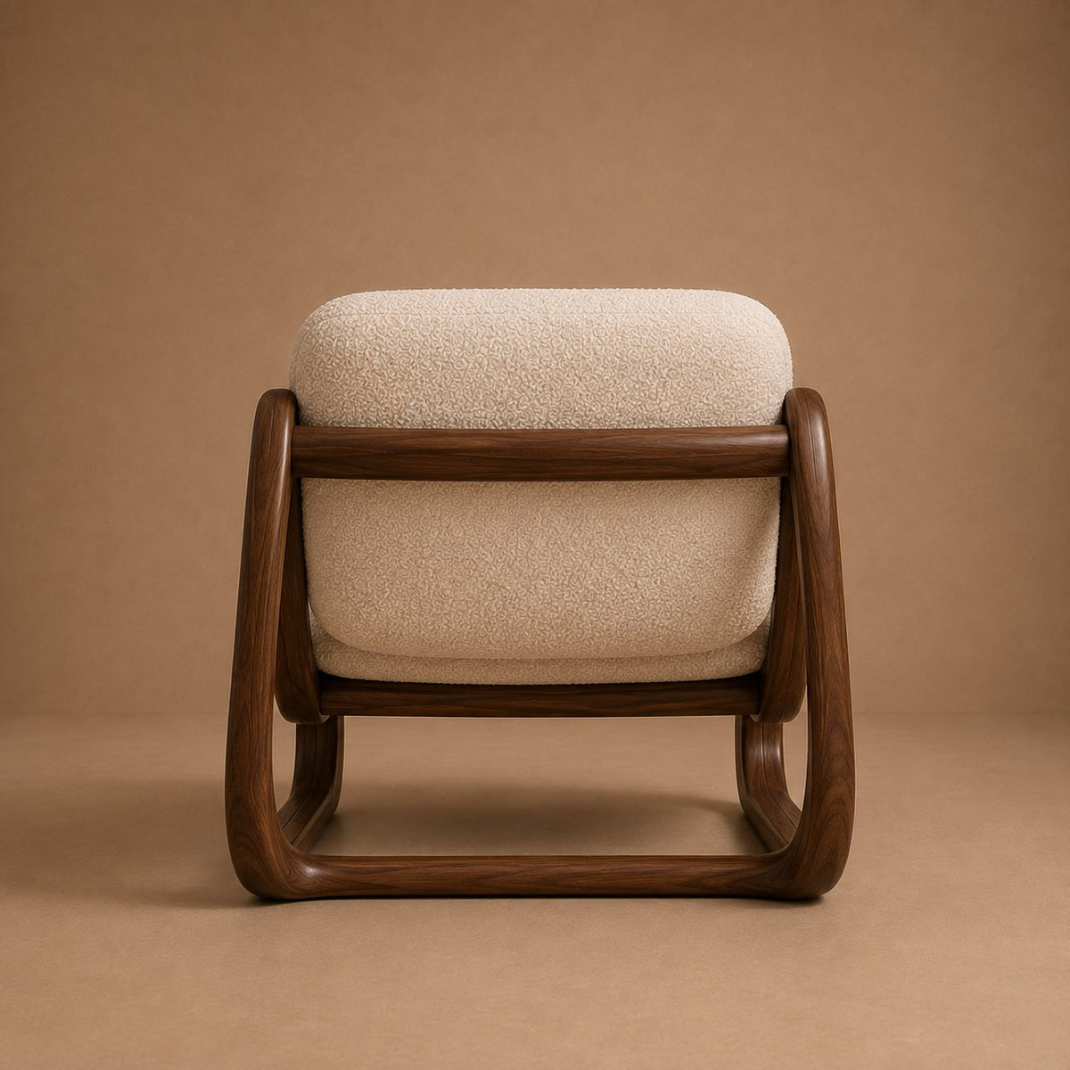 Anka lounge chair from behind, showing the open frame and cross rail