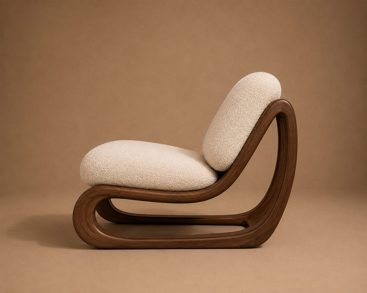 Anka lounge chair, side profile showing the continuous bent frame and its closed floor loop