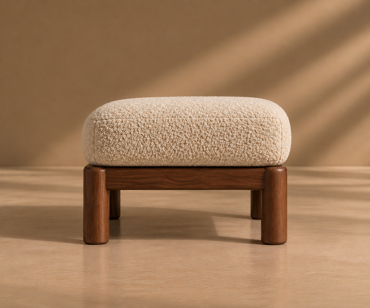 Hapi ottoman, front view, a textured cushion on a low wooden base