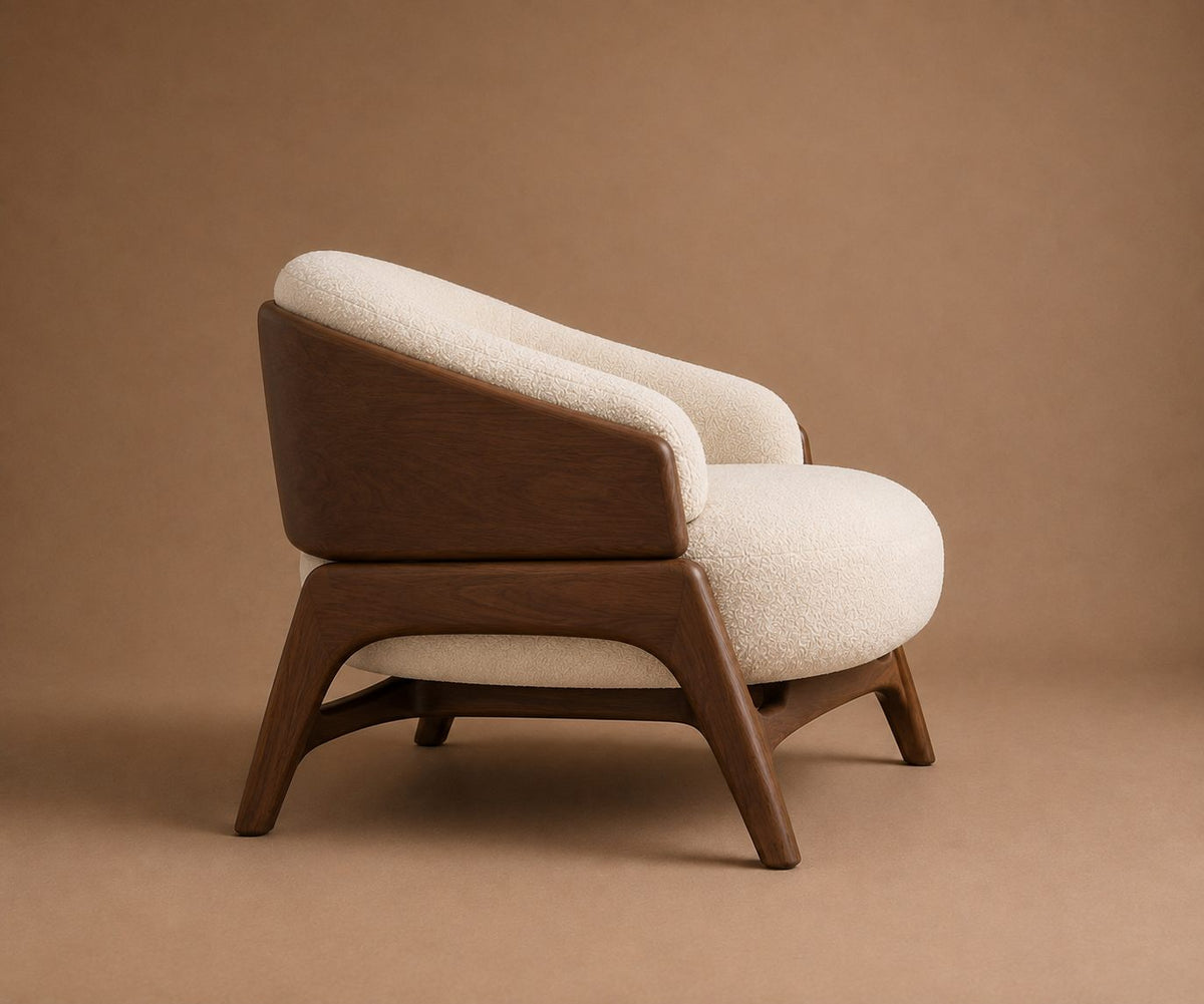Nefer armchair from behind at an angle, showing the solid back panel