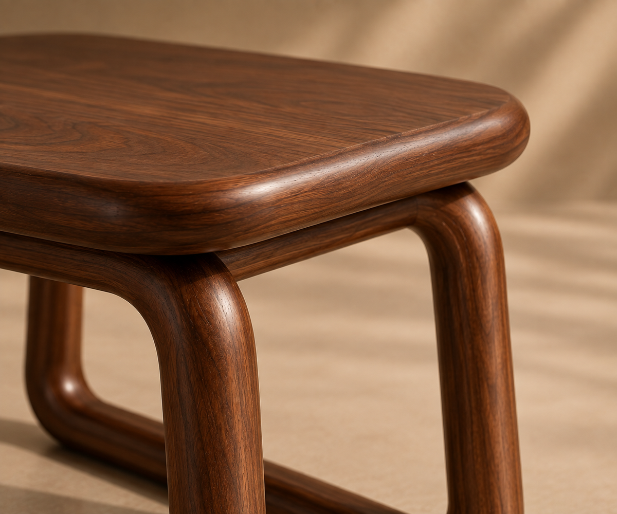 Close detail of the radiused tabletop edge where it meets the rounded leg